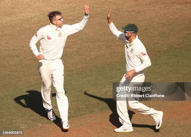 Todd Murphy of Australia celebrates taking the wicket of Ravindra Jadeja of India during day three of the First Test match in the series between...