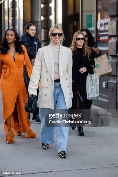 Lisa Aiken wears double breasted creme white blazer, black Bottega Veneta bag, denim jeans outside Rodarte during New York Fashion Week on February...