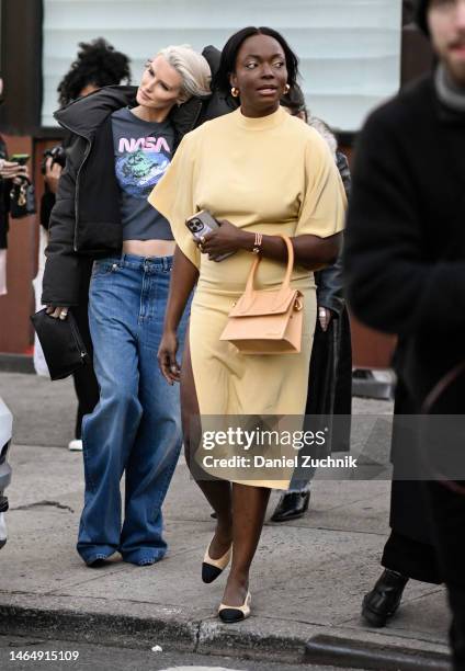 Guest is seen wearing a yellow dress and Jacquemus bag outside the Rodarte show during New York Fashion Week F/W 2023 on February 10, 2023 in New...