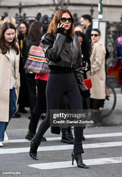 Christine Centenera is seen wearing a black leather jacket, black skinny pants, black heels and brown sunglasses outside the Rodarte show during New...