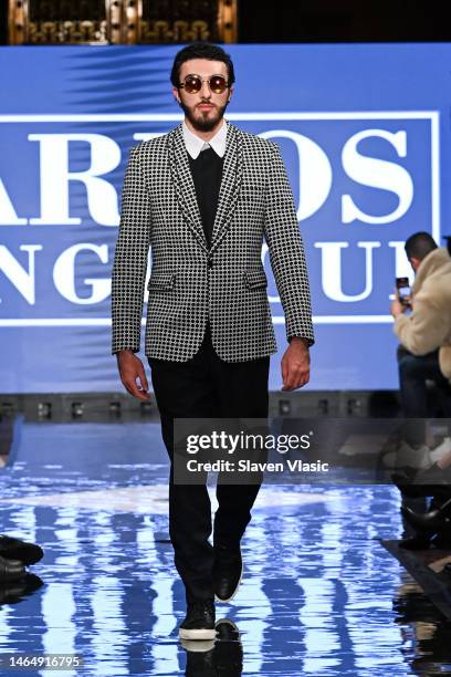 Model walks the runway wearing Carlos Benguigui during NYFW hiTechMODA Season 9 at Gotham Hall on February 10, 2023 in New York City.