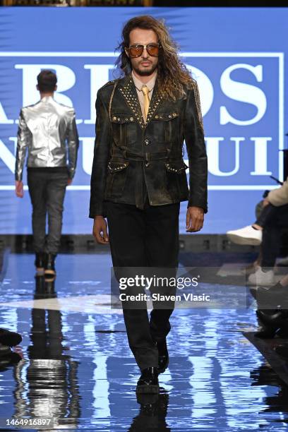 Model walks the runway wearing Carlos Benguigui during NYFW hiTechMODA Season 9 at Gotham Hall on February 10, 2023 in New York City.