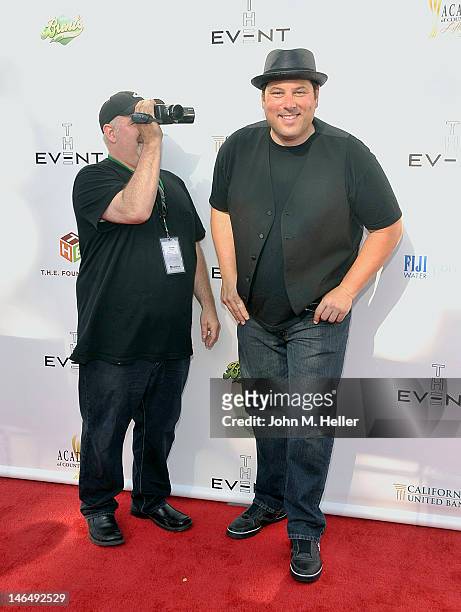 Actor Greg Grunberg has his videographer with him as he arrives at T.H.E. Event at the Calabasas Tennis and Swim Center on June 9, 2012 in Calabasas,...