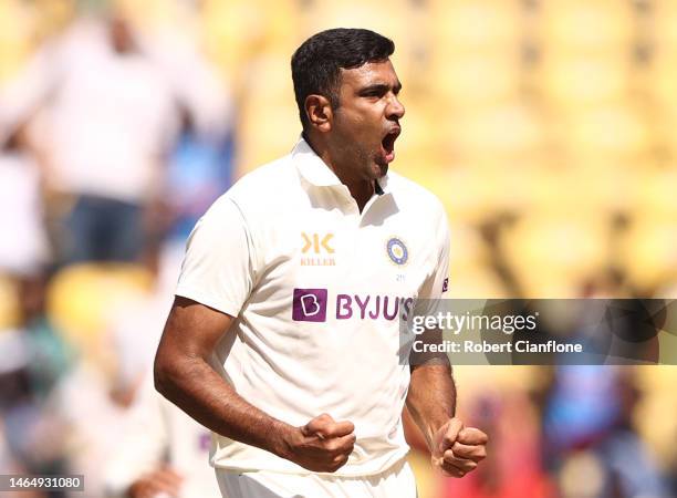 Ravichandran Ashwin of India celebrates taking the wicket of David Warner of Australia during day three of the First Test match in the series between...