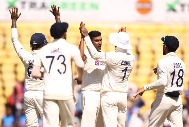 Ravichandran Ashwin of India celebrates taking the wicket of David Warner of Australia during day three of the First Test match in the series between...