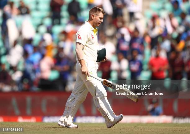 David Warner of Australia walks off after he was dismissed by Ravichandran Ashwin of India during day three of the First Test match in the series...