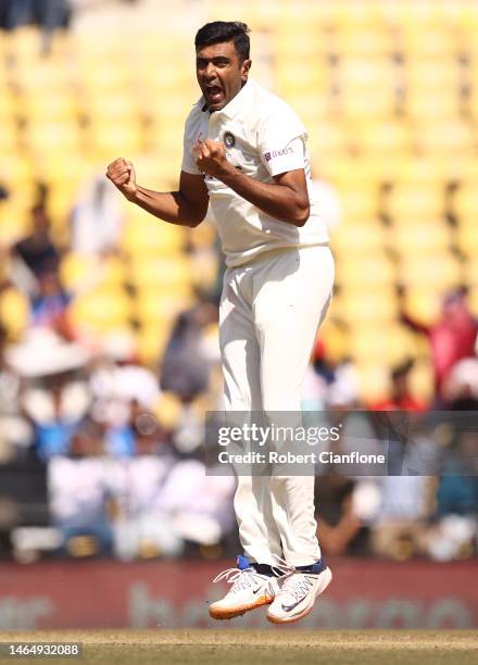 Ravichandran Ashwin of India celebrates taking the wicket of Matthew Renshaw of Australia during day three of the First Test match in the series...