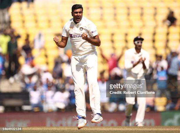 Ravichandran Ashwin of India celebrates taking the wicket of Matthew Renshaw of Australia during day three of the First Test match in the series...