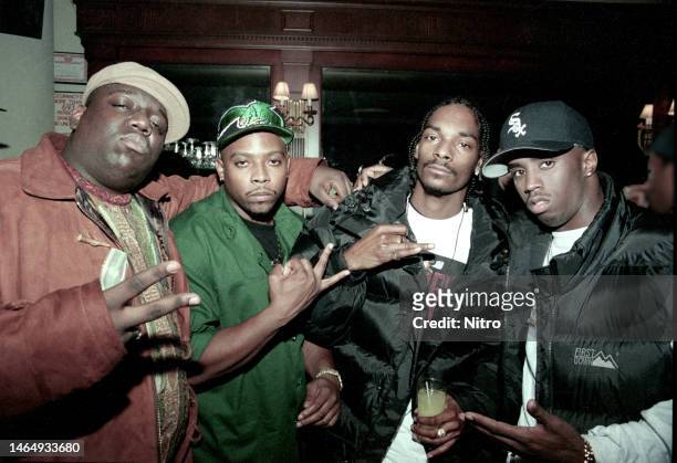 Portrait of, from left, American rappers Notorious BIG , Nate Dogg , Snoop Dogg , and Sean Combs attend the premiere party for 'Murder Was the Case'...