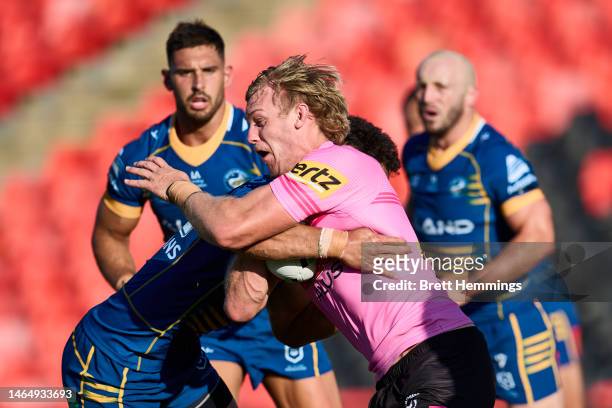 Lindsay Smith of the Panthers is tackled during the NRL Trial Match between the Penrith Panthers and the Parramatta Eels at BlueBet Stadium on...