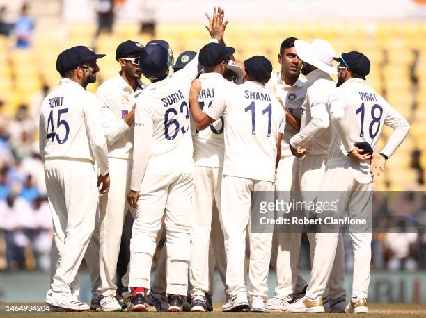 Ravichandran Ashwin of India celebrates taking the wicket of Peter Handscomb of Australia during day three of the First Test match in the series...