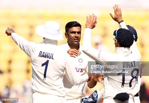 Ravichandran Ashwin of India celebrates taking the wicket of Alex Carey of Australia during day three of the First Test match in the series between...