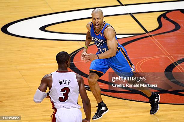 Derek Fisher of the Oklahoma City Thunder reacts towards Dwyane Wade of the Miami Heat in the second half of Game Three of the 2012 NBA Finals on...