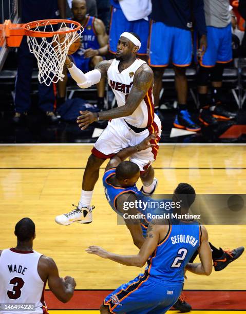 LeBron James of the Miami Heat makes a basket in the fourth quarter against Kevin Durant of the Oklahoma City Thunder in Game Three of the 2012 NBA...