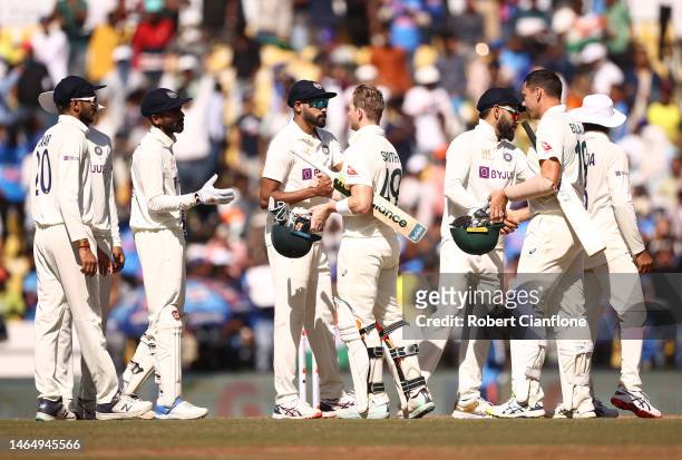 Players shake hands after India defeated Australia during day three of the First Test match in the series between India and Australia at Vidarbha...