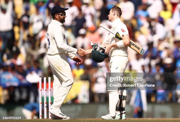 Rohit Sharma of India and Steve Smith of Australia shake hands after India defeated Australia during day three of the First Test match in the series...