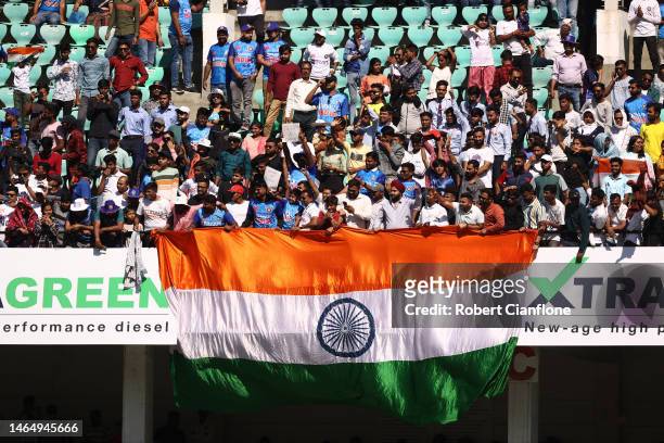 Fans cheer during day three of the First Test match in the series between India and Australia at Vidarbha Cricket Association Ground on February 11,...