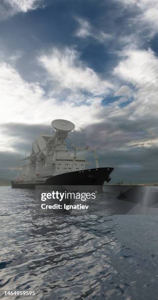 scientific or military barge with large radio antennas pointing in the sky in a daylight against the clouded sky - 4k resolution stock pictures, royalty-free photos & images