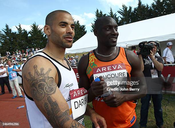 Garfield Darien , Ladji Doucoure pose after the 110m hurdles final during the 2012 French Elite Athletics Championships at the Stade du Lac de Maine...