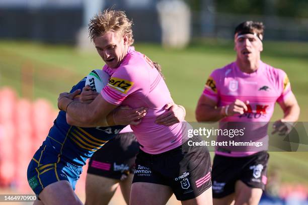 Lindsay Smith of the Panthers is tackled during the NRL Trial Match between the Penrith Panthers and the Parramatta Eels at BlueBet Stadium on...