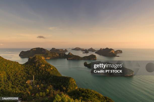 the sunrise and its light shines on the mountains in the sea green. also known as the ang thong islands, koh samui, surat thani. - north queensland stock pictures, royalty-free photos & images