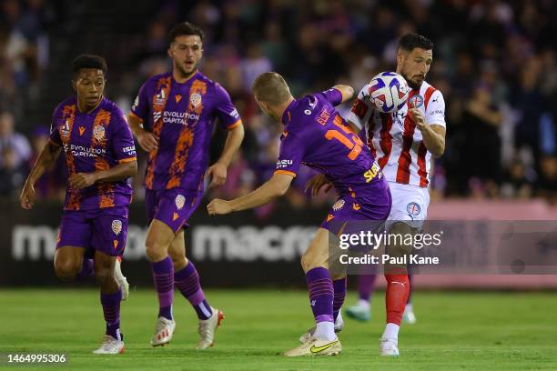 Jordan Elsey of the Glory and Mathew Leckie of Melbourne City contest for the ball during the round 16 A-League Men's match between Perth Glory and...