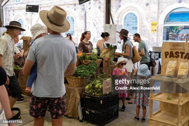 People shop at Carriageworks Farmers Market on February 11, 2023 in Sydney, Australia. The weekly Carriageworks Farmers Market, located in the...