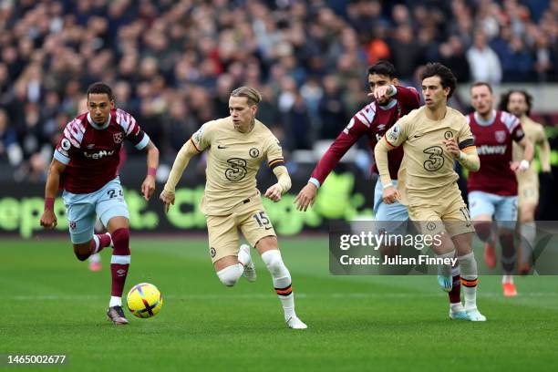 Mykhailo Mudryk of Chelsea is put under pressure by Thilo Kehrer of West Ham United during the Premier League match between West Ham United and...