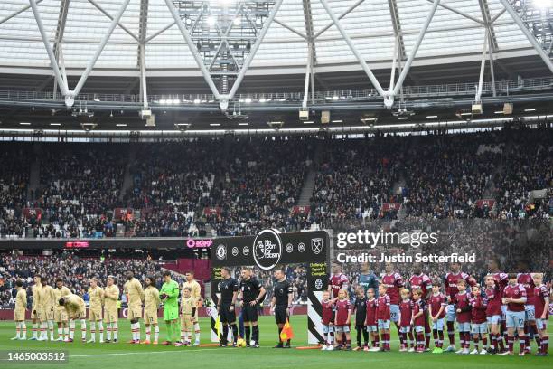 Chelsea and West Ham United players line up under the 'No Room For Racism' handshake board prior to the Premier League match between West Ham United...