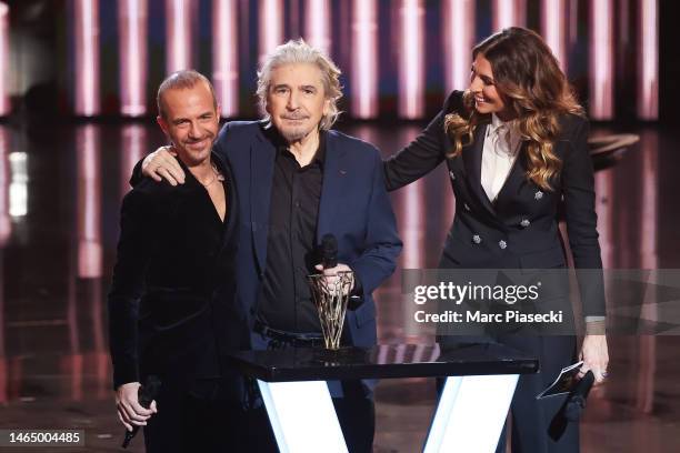 Serge Lama receives the 'Victoire d'Honneur' award from singer Calogero during the 38th "Les Victoires De La Musique" Award Ceremony At La Seine...