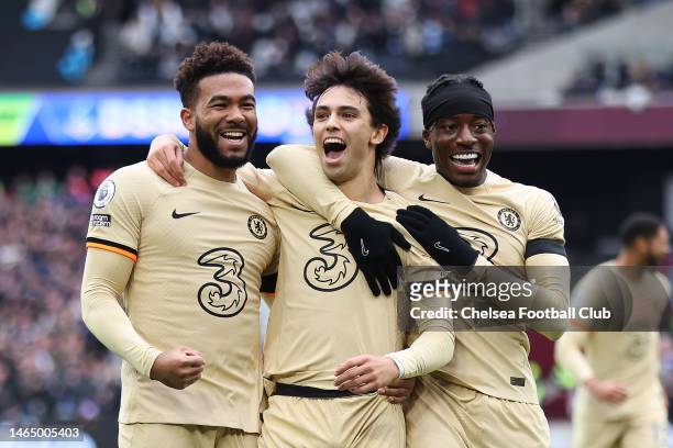 Joao Felix of Chelsea celebrates with teammates Reece James and Noni Madueke after scoring the team's first goal during the Premier League match...