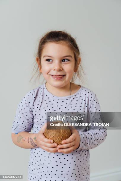 portrait of girl with coconut and straw, happy emotion, white background - coconut water isolated stock pictures, royalty-free photos & images