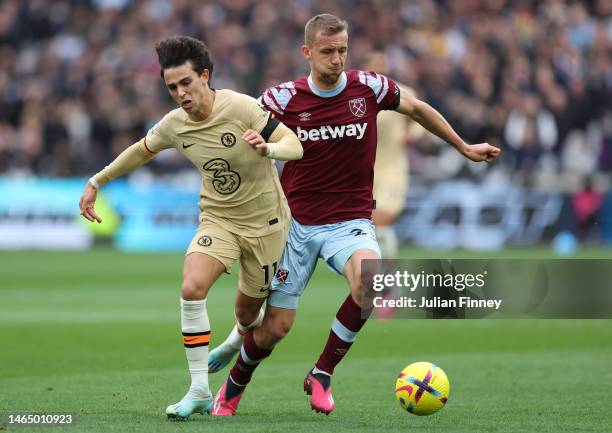 Joao Felix of Chelsea is challenged by Tomas Soucek of West Ham United during the Premier League match between West Ham United and Chelsea FC at...