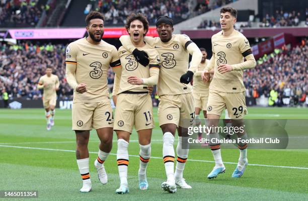 Joao Felix of Chelsea celebrates with teammates Reece James and Noni Madueke after scoring the team's first goal during the Premier League match...