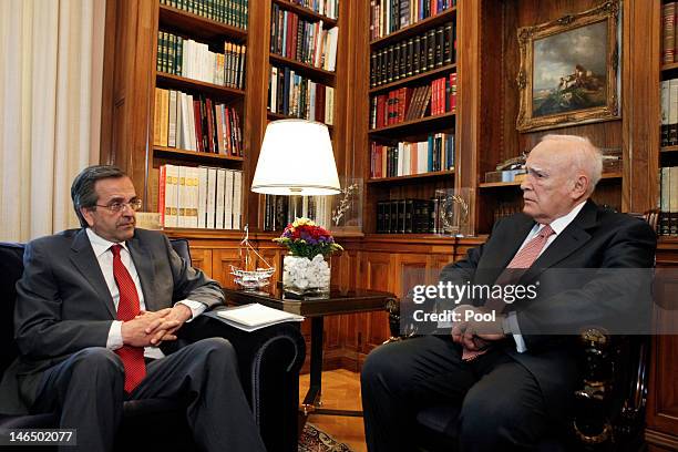 Greek President Karolos Papoulias meets leader of conservative New Democracy party Antonis Samaras before he receives a mandate to form a government...