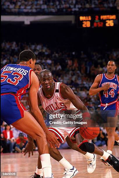 Michael Jordan of the Chicago Bulls takes the ball to the basket during the game against the Detroit Pistons. NOTE TO USER: It is expressly...