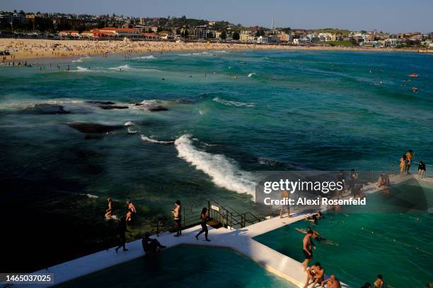 People swim and walk at the Bondi Icebergs Club at Bondi Beach on February 11, 2023 in Sydney, Australia. The Bondi Icebergs Club, aka the famous...