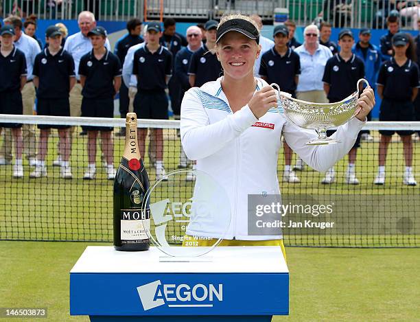 Melanie Oudin of USA celebrates with the Maud Watson Trophy after victory over Jelena Jancovic of Serbia during the singles final match on day eight...