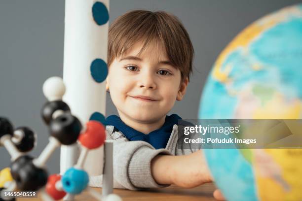 little boy at chemistry class - rocket scientist stock pictures, royalty-free photos & images