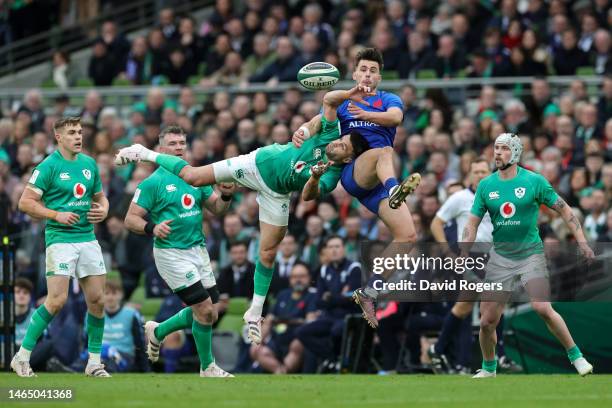 Conor Murray of Ireland is tackled by Ethan Dumortier of Fran during the Six Nations Rugby match between Ireland and France at Aviva Stadium on...
