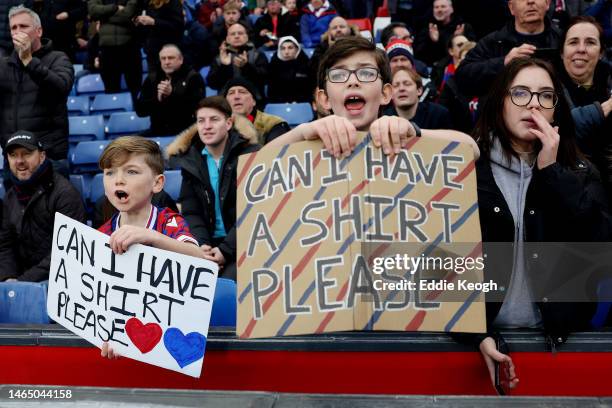 Crystal Palace fans hold banners which read 'Can I Have A Shirt Please' prior to the Premier League match between Crystal Palace and Brighton & Hove...