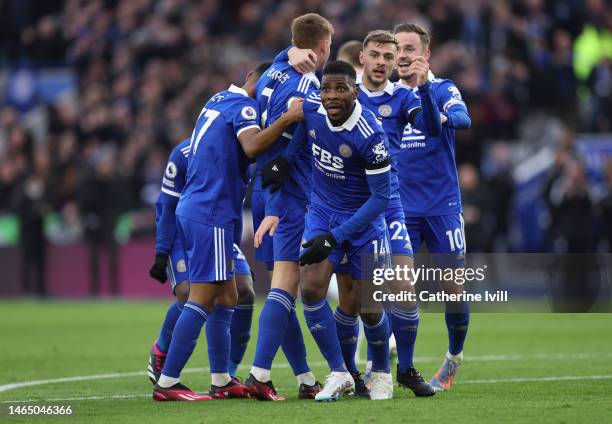 Kelechi Iheanacho of Leicester City celebrates with teammates after scoring the team's third goal during the Premier League match between Leicester...