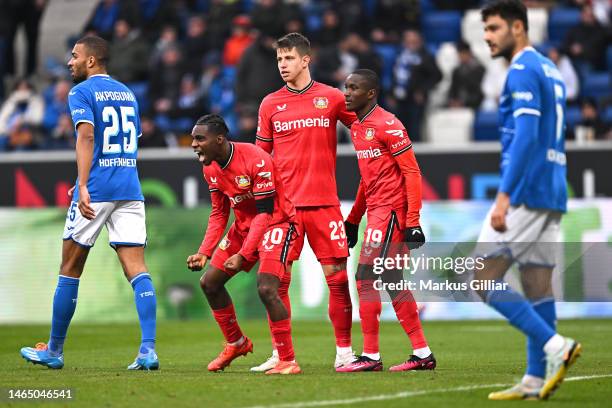 Moussa Diaby of Bayer 04 Leverkusen celebrates with teammates Jeremie Frimpong and Adam Hlozek after scoring the team's second goal during the...