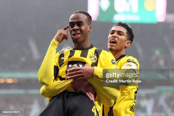 Jamie Bynoe-Gittens of Borussia Dortmund celebrates with teammate Jude Bellingham after scoring the team's first goal during the Bundesliga match...