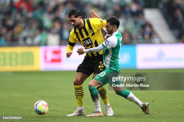 Emre Can of Borussia Dortmund battles for possession with Leonardo Bittencourt of SV Werder Bremen during the Bundesliga match between SV Werder...