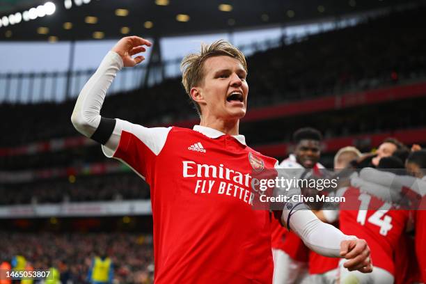 Martin Odegaard of Arsenal celebrates his team's first goal during the Premier League match between Arsenal FC and Brentford FC at Emirates Stadium...