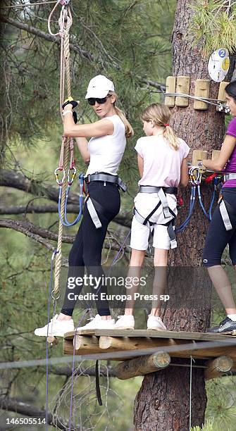 Julio Iglesias' wife Miranda Rinsjburger and her daughter Victoria Iglesias are seen playing with tirolina on June 5, 2012 in Marbella, Spain.