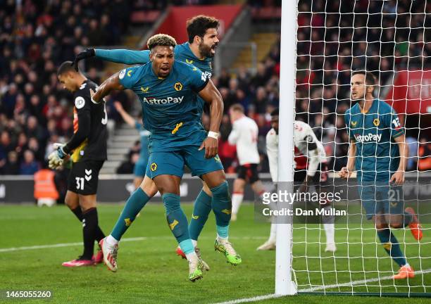 Adama Traore and Diego Costa of Wolverhampton Wanderers celebrate their team's first goal, an own goal scored by Jan Bednarek of Southampton during...