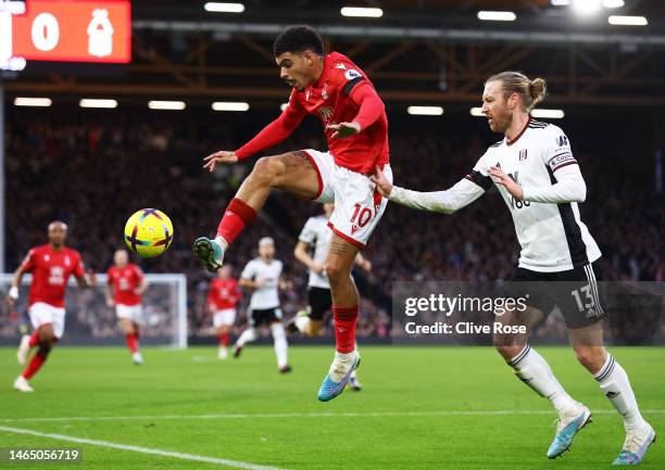 Morgan Gibbs-White of Nottingham Forest is challenged by whilst under pressure from Tim Ream of Fulham during the Premier League match between Fulham...