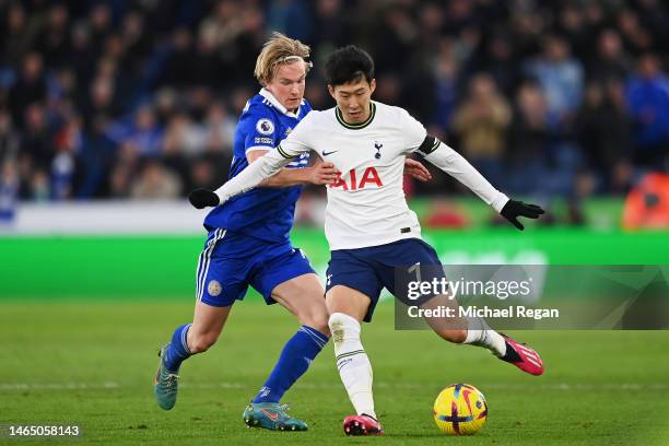 Son Heung-Min of Tottenham Hotspur is challenged by Victor Kristiansen of Leicester City during the Premier League match between Leicester City and...